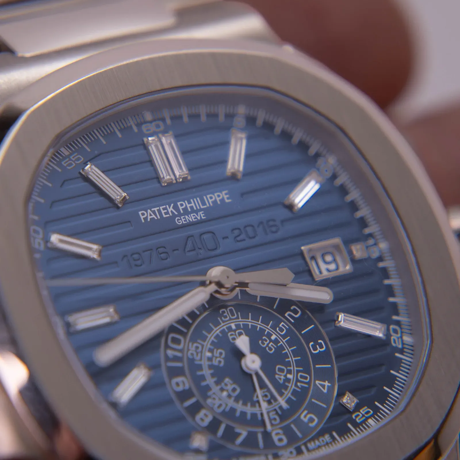 Close-up of a Patek Philippe Nautilus chronograph with a blue 1976–2016 40th anniversary dial