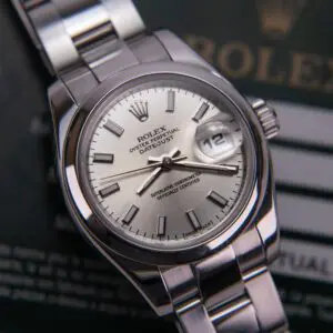 Silver Rolex watch with date display.