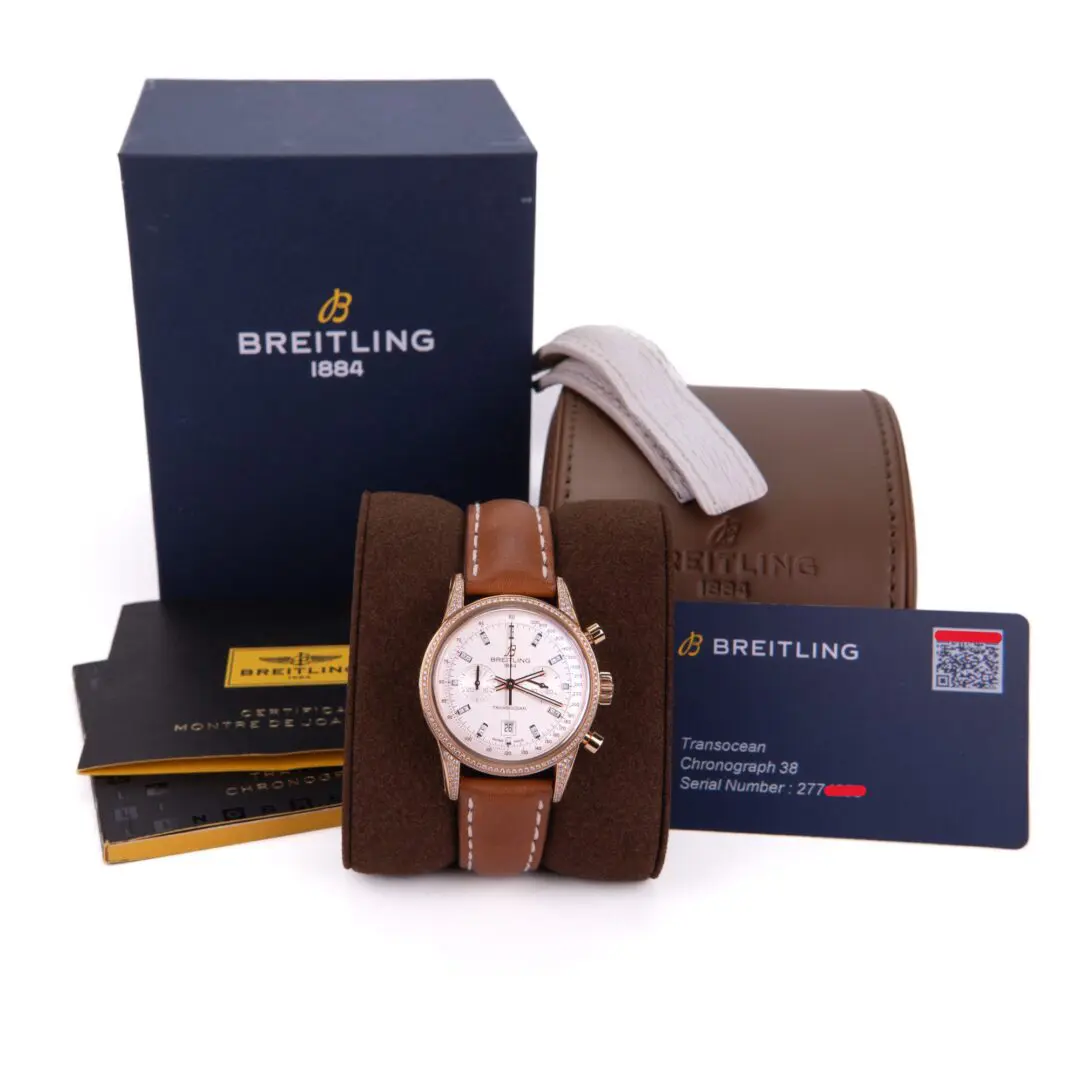 Breitling watch with box and warranty cards.
