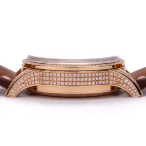 Gold watch with diamond accents and strap.