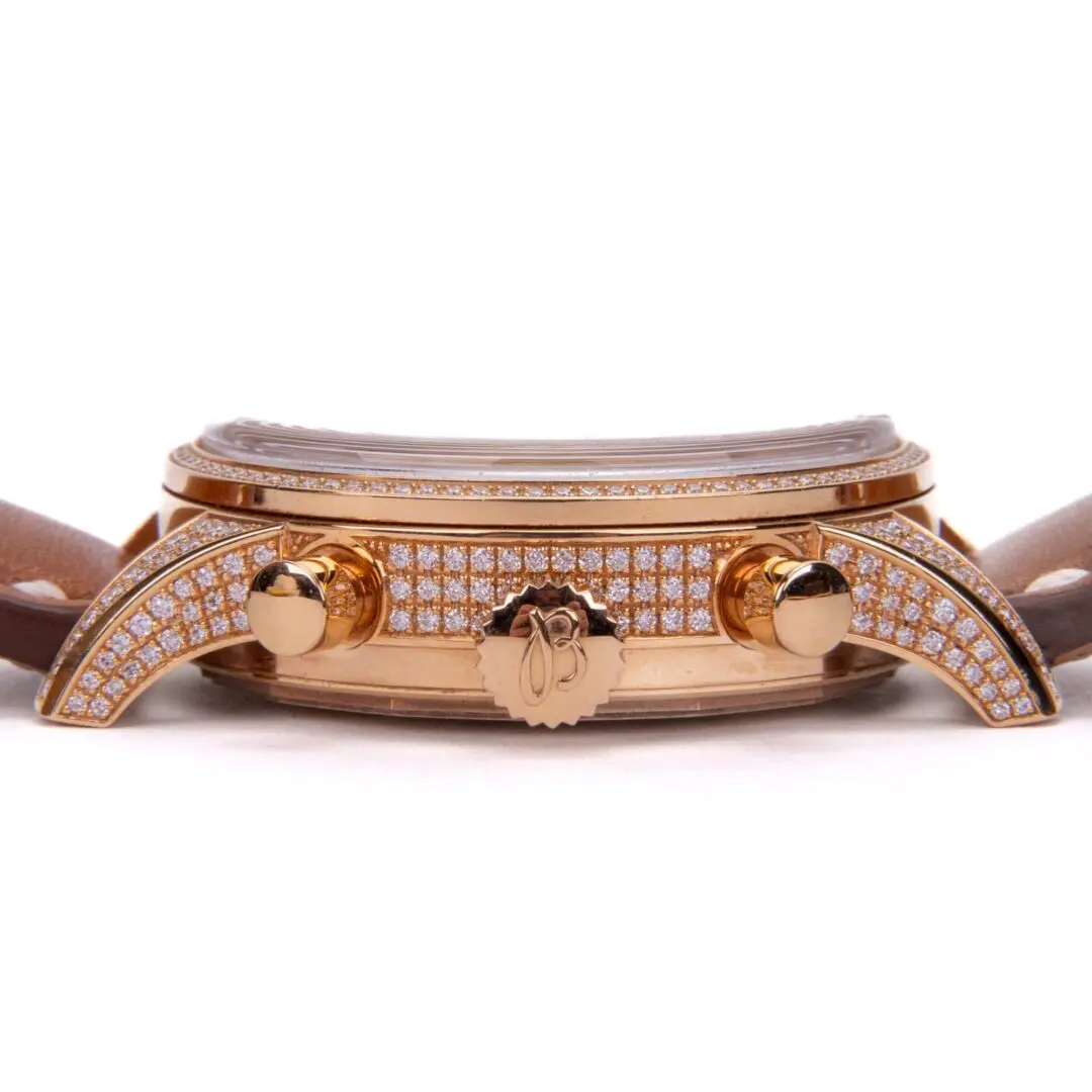 Luxurious diamond-encrusted gold watch with leather strap.