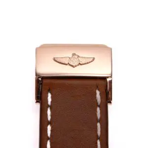 Brown leather watch strap with metal clasp.