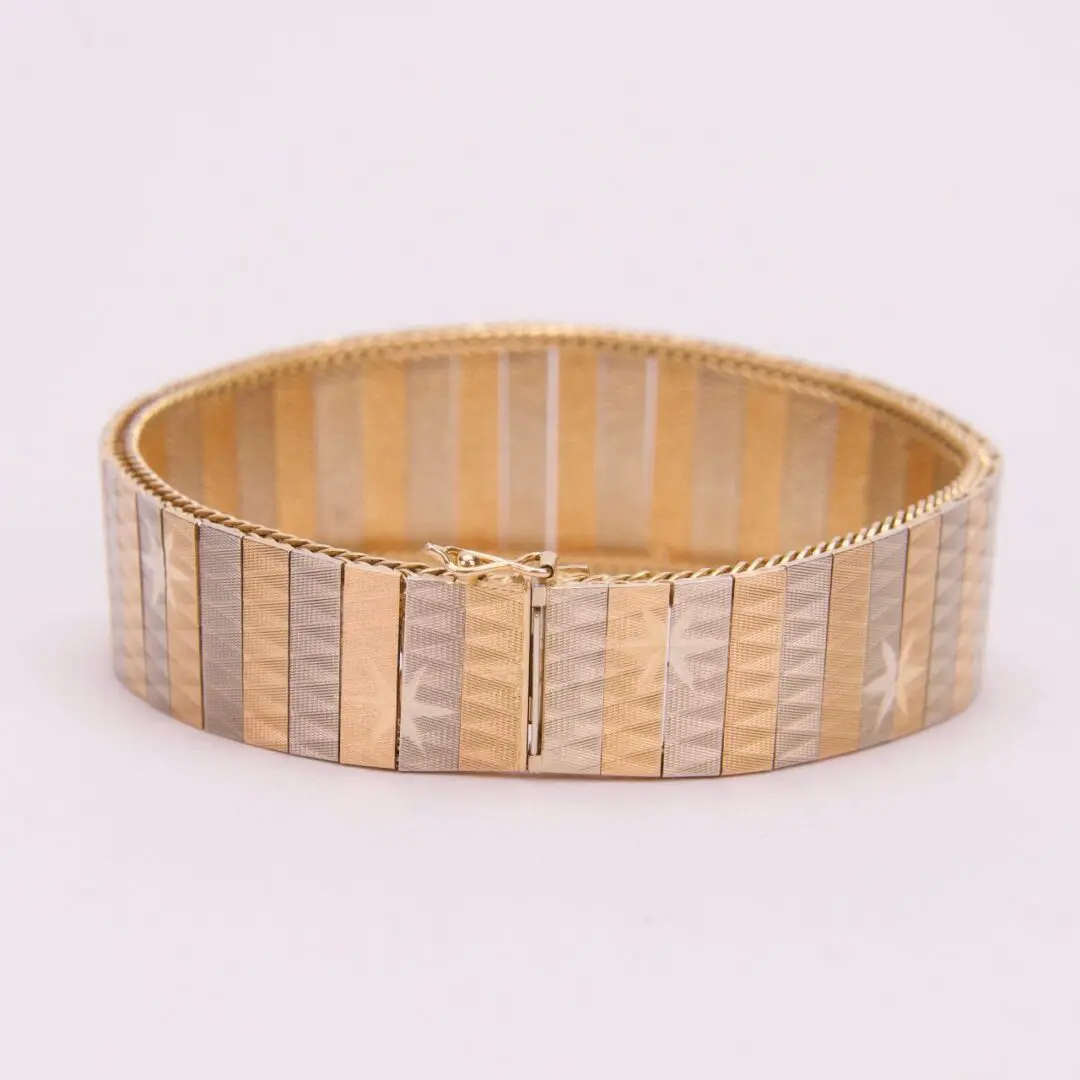 Gold and silver striped bracelet design.