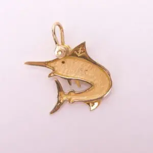 Gold fish-shaped pendant on light background.