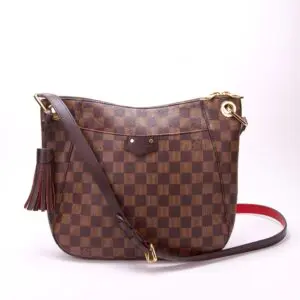 Checkered brown handbag with gold accents.