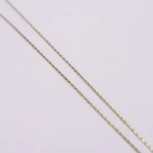 Gold chains on a light background.