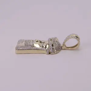 Gold and diamond pharaoh-themed pendant.