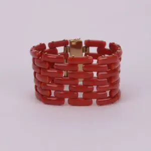 Red beaded bracelet with gold clasp.