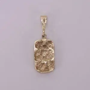 Gold textured pendant on plain background.
