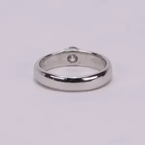 Silver ring with a single diamond.