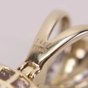 Close-up of 14k gold jewelry hallmark.