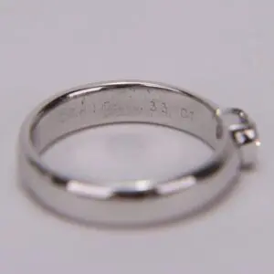 Silver ring with engraved inscription inside.