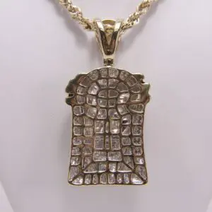 Gold pendant with intricate diamond pattern.