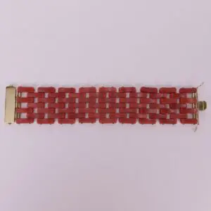 Red link bracelet with gold clasps.