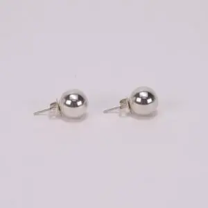 Silver ball stud earrings on white background.
