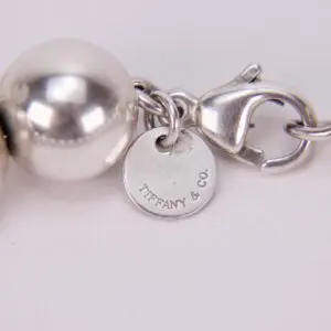 Silver jewelry with Tiffany & Co. tag.