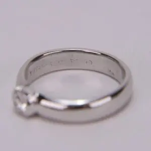 Platinum diamond ring on soft background.
