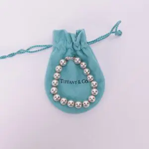 Silver bracelet on blue Tiffany pouch.