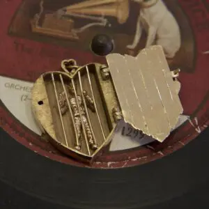 Heart locket on vintage record label.