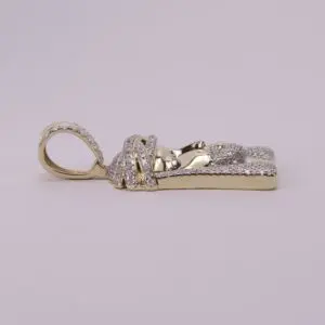 Gold and diamond encrusted pendant, side view.