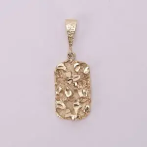 Gold textured pendant on plain background.