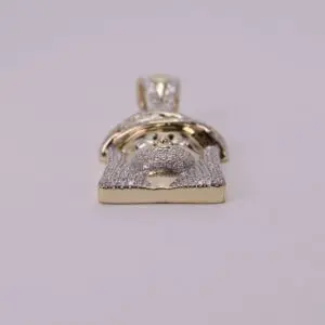 Gold Jesus face pendant with diamonds.