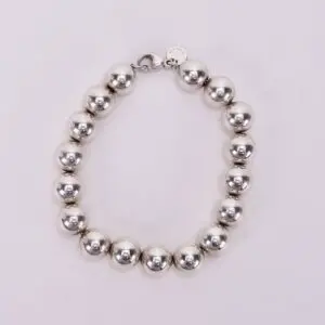 Silver bead bracelet on white background.
