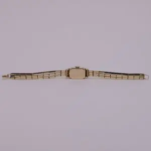 Gold wristwatch with metal strap.