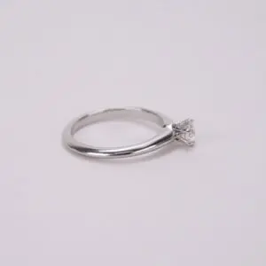 Silver ring with a diamond solitaire setting.