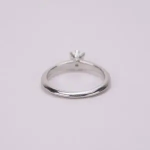 Silver ring with a small gemstone.