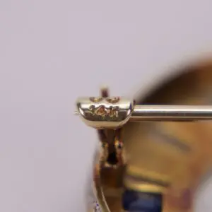 Gold clasp with "14K" engraving close-up.