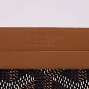 Brown leather with patterned fabric detail.