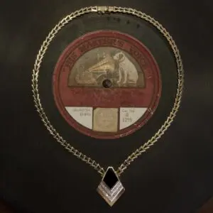 Vintage record with decorative gold necklace.