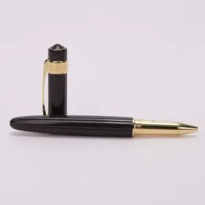 Black and gold ballpoint pen on display.