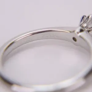 Engraved silver ring with a gemstone.