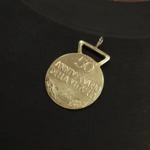 Gold medal commemorating 50th anniversary.
