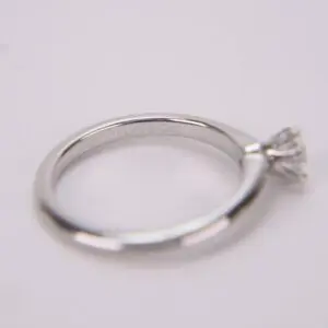Silver engagement ring with diamond solitaire.