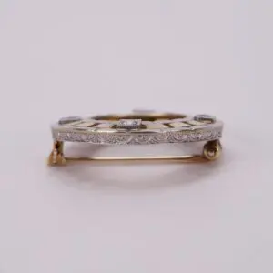 Gold and silver brooch with diamonds.