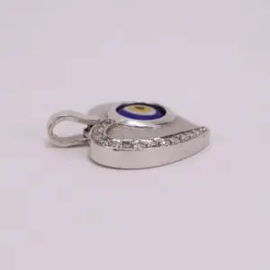 Silver eye-shaped pendant with rhinestones.
