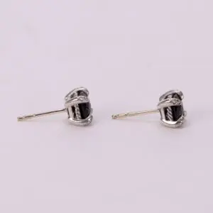 Silver earrings with black stones.