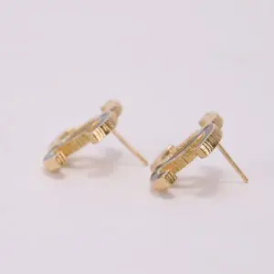 Gold stud earrings with textured design.