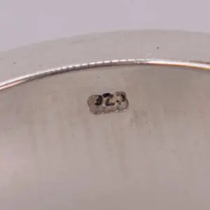 Silver jewelry stamp reading ".925" close-up.
