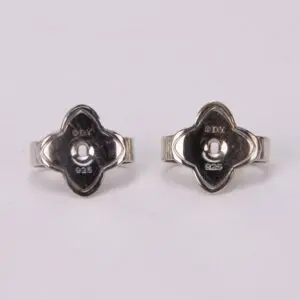 Silver earrings with unique floral design.
