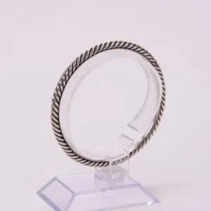 Silver twisted rope design bracelet display.