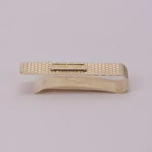 Gold textured money clip on white background.