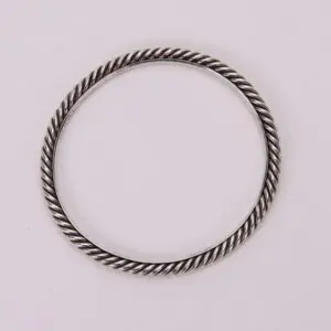 Silver twisted rope-style bracelet on display.