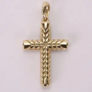 Gold cross pendant with engraved details.