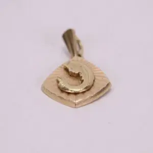 Gold pendant with a fish design.