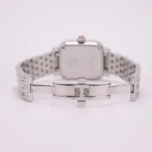 Silver watch with open metal clasp.