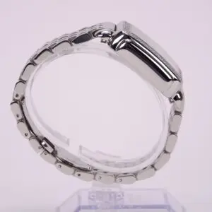 Silver metal watch with linked bracelet.